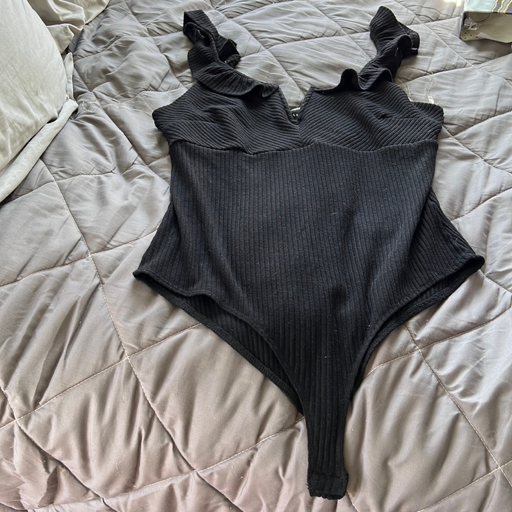 This top worn one time XL fits like a L